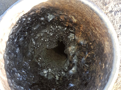 Lined chimney blocked with tar. Very danerous.